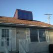 This is the Nortern Comfort solar hot air panel installed in a roof dormer.